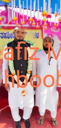 This live wallpaper features two men dressed in traditional samikshavad attire