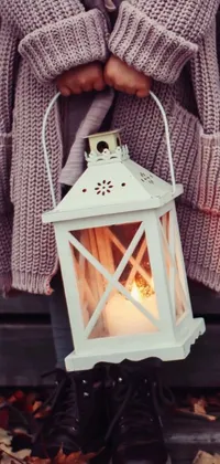 Spruce up your phone with this charming live wallpaper featuring a vintage lantern emitting warm and inviting glow