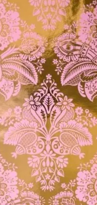 This stunning phone live wallpaper features an intricate, gold and pink floral pattern on a reflective gold plate