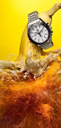This dynamic phone wallpaper showcases a stunning image of a banana with a watch on it