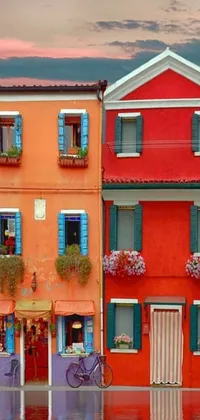 This live wallpaper for your phone features two terracotta buildings with bright, colorful stripes running down their sides