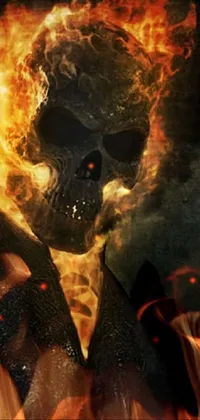 This phone live wallpaper showcases a stunning digital rendering of a fire skull set against a dark, smoky backdrop