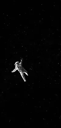 This live phone wallpaper features a black and white photo of an astronaut in space, set against a starry backdrop