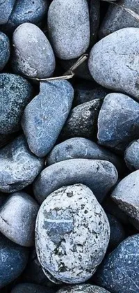 This live wallpaper for your phone features a pile of rocks with shades of blue and grey creating a soothing vibe