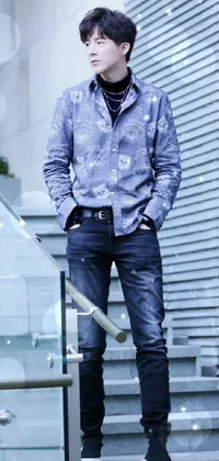 This live wallpaper captures the essence of a man standing on the steps of a building wearing a dark shirt and jeans with paisley detailing, evoking a rugged yet sophisticated vibe