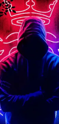 This live wallpaper features a hooded person standing in front of a vibrant neon sign