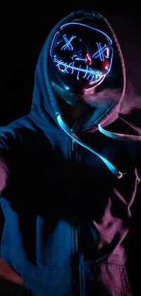 Download A Person Wearing A Neon Mask With A Hoodie Wallpaper