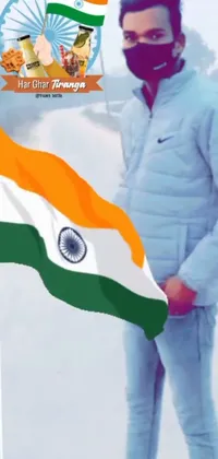 This phone live wallpaper showcases a man dressed in warm clothing and a face mask, holding the flag of India against a snowy backdrop