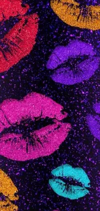 Looking for a vibrant and lively phone wallpaper? Look no further than this stunning pointillism-style artwork featuring a group of colorful lipsticks set against a black background
