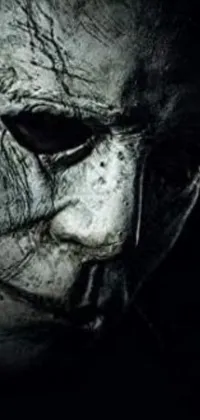This Live Wallpaper features an eerie image of a Michael Myers mask, likely inspired by the famous horror movie character from "Halloween