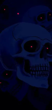 This live wallpaper features a striking digital art image of two skulls rendered in dark blue skin with glowing red and blue eyes
