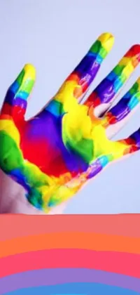 Introducing a stunning Rainbow Hand Live Wallpaper for your phone! This wallpaper captures a Neo-Fauvism style open palm with a colorful rainbow painted on it