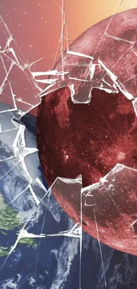 This dynamic phone live wallpaper showcases a captivating scene of a shattered window with a mesmerizing planet in the backdrop