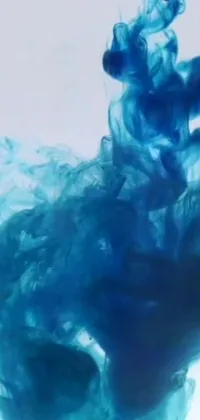 Elevate your phone's appearance with a stunning live wallpaper featuring a mesmerizing blue substance in water