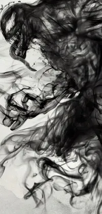 This live wallpaper showcases a striking black and white photo of a skateboarder, accented by digital art in the form of stylized liquid smoke