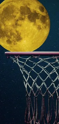 This live wallpaper for your phone features a stunning basketball hoop against the backdrop of a full moon