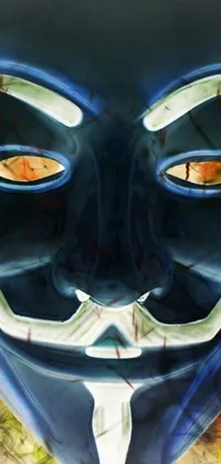 This striking live wallpaper depicts a masked character wearing a "V for Vendetta" mask, complete with a wicked grin and blue-toned face