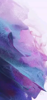 Discover an mesmerizing digital close-up live wallpaper with swirling sand effect that features purple and blue hues