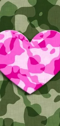 This live wallpaper features a vibrant design with a pink camouflage heart set against a green background - perfect for those who love both military and feminine elements