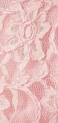 This phone live wallpaper features a gorgeous close-up of a pink lace fabric with intricate floral patterns
