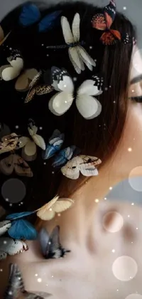 This beautiful live wallpaper features a woman with stunning butterflies perched atop her head, made with silk paper hair ornaments