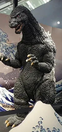 This phone live wallpaper features an intricately designed godzilla statue on display in a museum