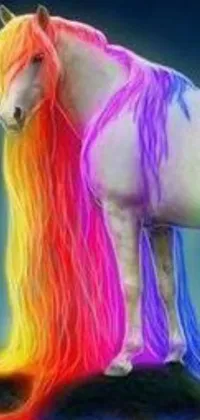 This phone live wallpaper features a rainbow colored horse standing on a rock with beautiful, long, flowing fire hair