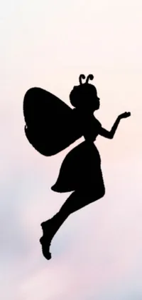 This phone live wallpaper features a charming and magical silhouette of a fairy gracefully flying through the air