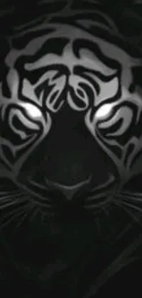 The Tiger Live Wallpaper is a stunning depiction of a tiger's face in the dark, with sharp eyes and distinct markings