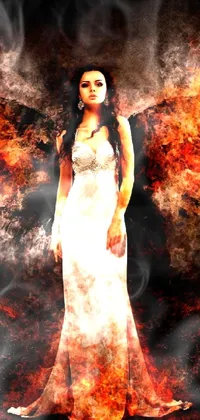 This visually stunning live wallpaper depicts a woman in a flowing white dress standing in a surreal, fiery landscape