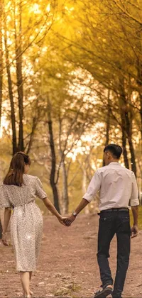 Decorate your phone screen with this captivating live wallpaper featuring a couple walking hand-in-hand through a forest