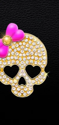This captivating phone live wallpaper showcases a gold skull wearing a charming pink bow set against a sleek black backdrop