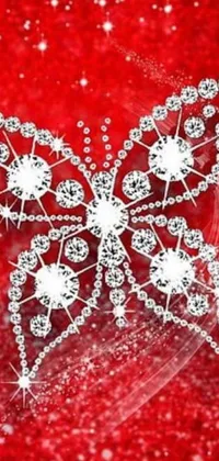 This stunning live wallpaper features a butterfly made out of diamonds, set on a red background with white sparkles and silver ornaments