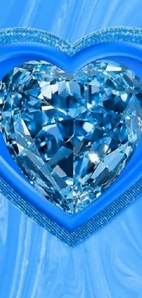 This beautiful phone live wallpaper showcases a heart-shaped diamond set against a lush blue background