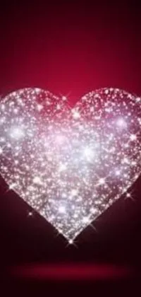 Looking for a romantic and mesmerizing phone live wallpaper? This glowing heart on a red background will do just that