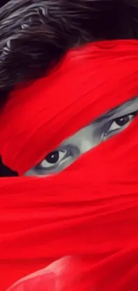 This phone live wallpaper features a mysterious woman with a red scarf covering her face