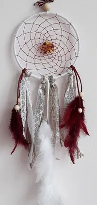 This live phone wallpaper features a captivating white and red dream catcher, set against a rusty, earthy background