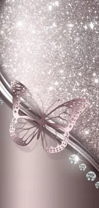 This phone live wallpaper features a stunning pink and silver background adorned with a beautifully designed butterfly in shades of purple and pink