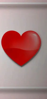 This live phone wallpaper depicts a charming white refrigerator with a red heart on it