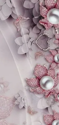 The elegant phone live wallpaper displays a close up of a dress, embellished with pearls and flowers