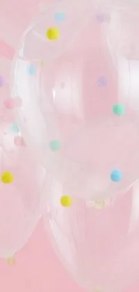 Looking for a cute and ethereal live wallpaper for your phone? Look no further than this lovely design featuring colorful balloons with confetti dots on them! Each balloon appears to flutter and move in the breeze, adding to the playful vibe of the wallpaper