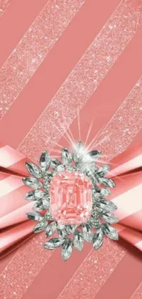 This phone live wallpaper features a stunning diamond bow on a soft pink background, evoking feelings of joy and positivity