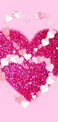 Looking to add a touch of glamour to your phone? Check out this dynamic and vibrant live wallpaper! Featuring a stunning pink glitter heart against a solid pink background, this wallpaper is sure to catch your eye