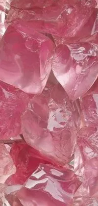 This live wallpaper showcases a stunning pile of pink crystals on top of an elegant table in a retro, vintage-style picture
