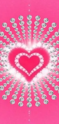 This live wallpaper features a heart shape made of sparkling diamonds on a stunning pink background