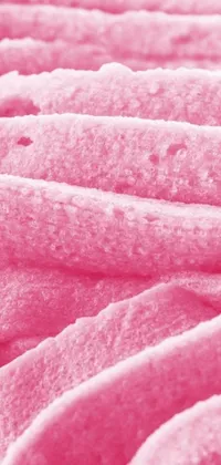 This live wallpaper features a stunning close-up of a pink blanket on a bed, captured in microscopic detail by a talented photographer