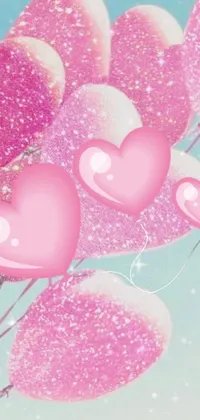 This phone live wallpaper features pink heart-shaped balloons in a charming digital art display