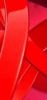 This striking live phone wallpaper features a detailed digital rendering of gorgeous red ribbons