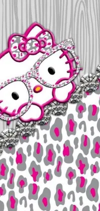 This delightful phone live wallpaper features two playful digital renderings of a black and white cartoon cat named Hello Kitty