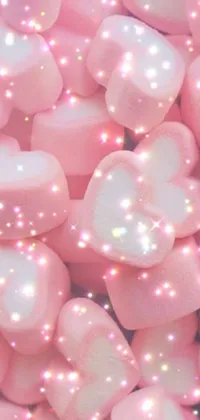 This phone live wallpaper showcases a mesmerizing pile of blush pink marshmallows in a magical girl theme